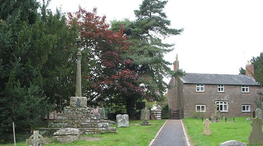 Part of St David's parish churchyard, Much Dewchurch, Herefordshire, with the churchyard cross on the left
