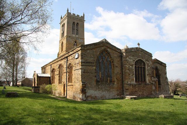 A historic church with a tall tower and arched windows.