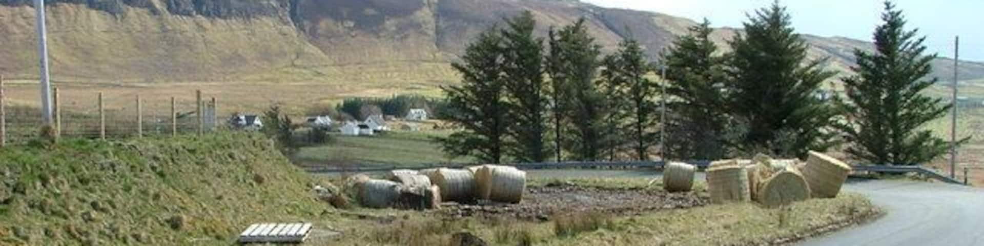 Bales at the Roadside Bales are delivered to some weird and wonderful places on Skye. This lot have been offloaded on a bend in the road at Linicro.