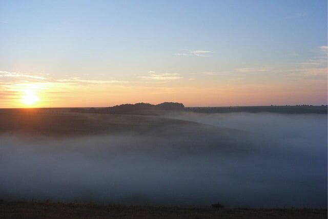 Sunrise over misty downland, Mere Mist was sitting in the complex series of dry valleys on the downs at Mere. This view initially looks across Aucombe Bottom towards a beechwood on Woodlands Hill.