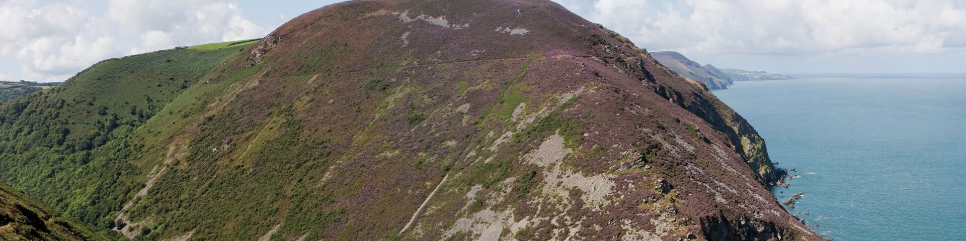 A view of the valley of the Heddon river, with the mouth of the Heddon to the lower right (out of view). Peter Rock can be seen on the opposing cliff. Photographs taken from Highveer Point on the South West Coast Path, North Devon.