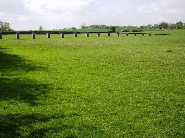 Pipeline to the sewage works I don't know what it contains, but the image is aesthetically pleasing, striding across the lower ground like a railway viaduct would do.
