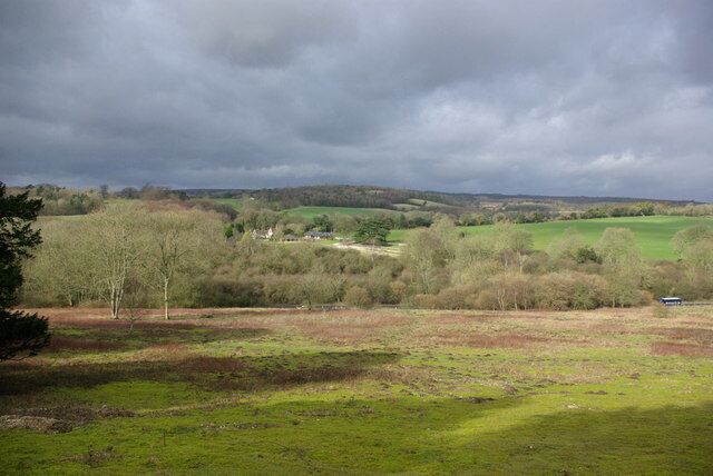View across Fairmile Bottom The field in the foreground (plagued by moles) finishes at the A29, just visible. Most of the view is Madehurst parish, a parish with hardly any village.