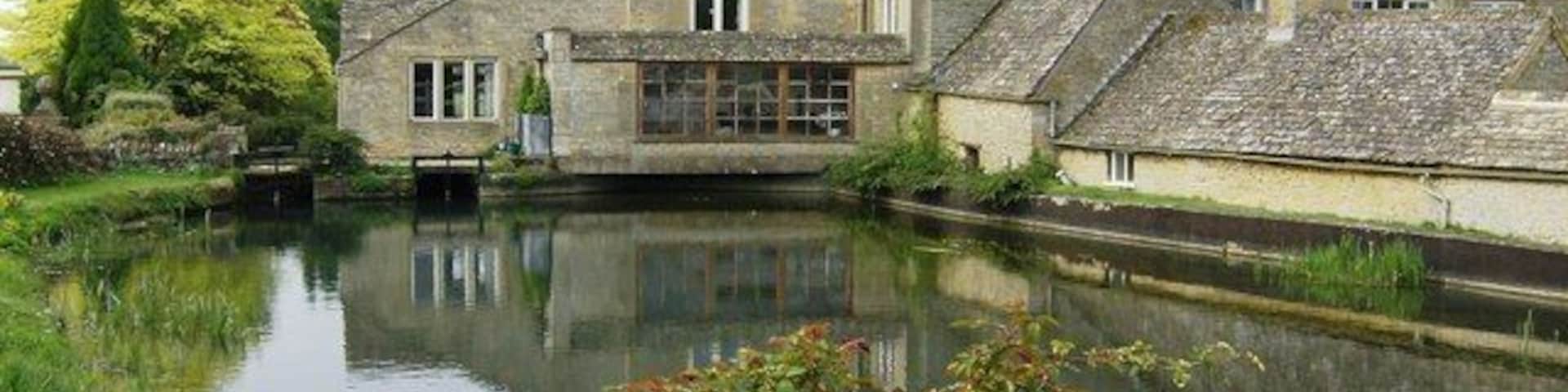 Hyde Mill The lake is formed by the damming of the River Dikler. It is crossed on a bridge that carries the Macmillan Way, the Gloucestershire Way and a popular local footpath to Lower Slaughter. Therefore this scene is probably photographed many times a day.