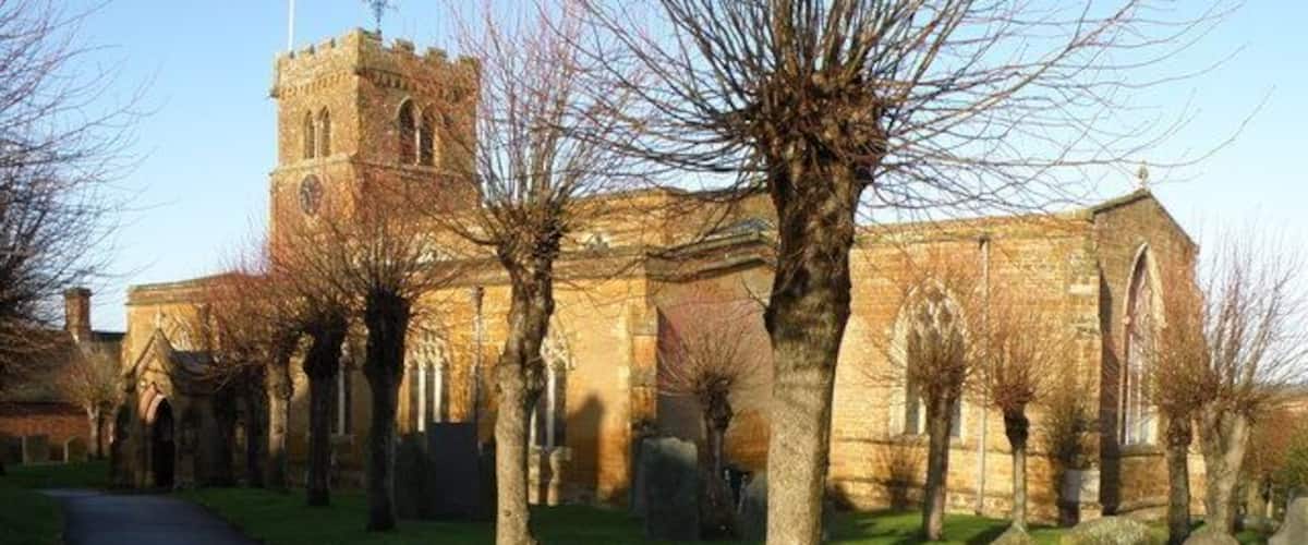 Long Buckby Church A bright December day enhances the colour of the local stone used in the construction of the church.