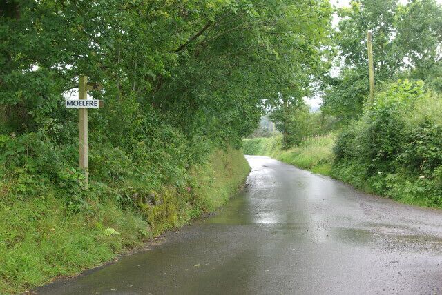 Lane east of Capel-y-Groes The Moelfre sign stands opposite the track leading to the farm.