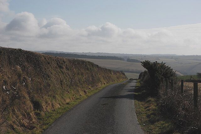 Minor road east of the A487 Descending into the Carrog valley, serving a few farms.