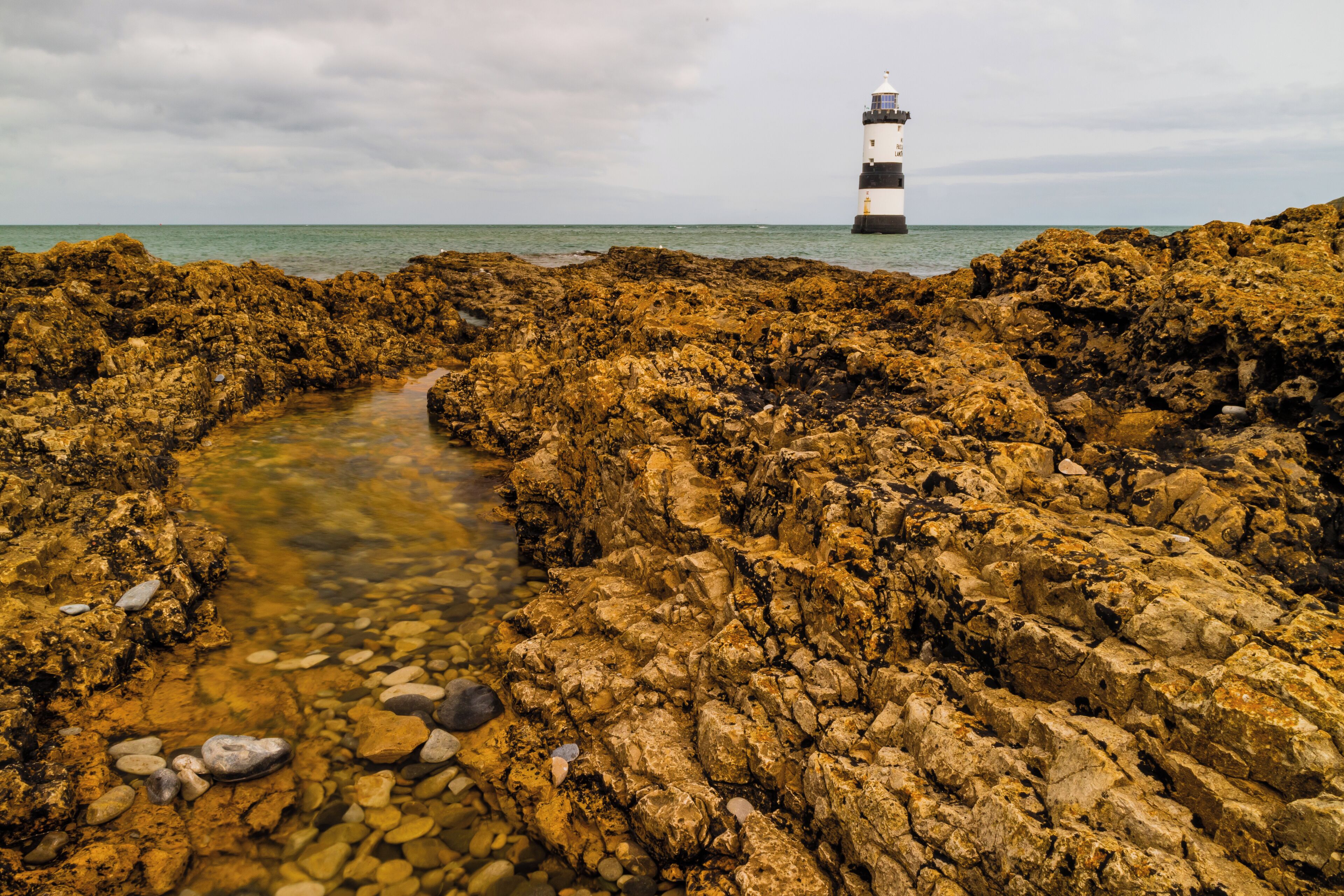 Penmon Lighthouse, Anglesey, N.Wales.  A quick visit only to find the tide was coming up to full height and the sky as grey as they come.