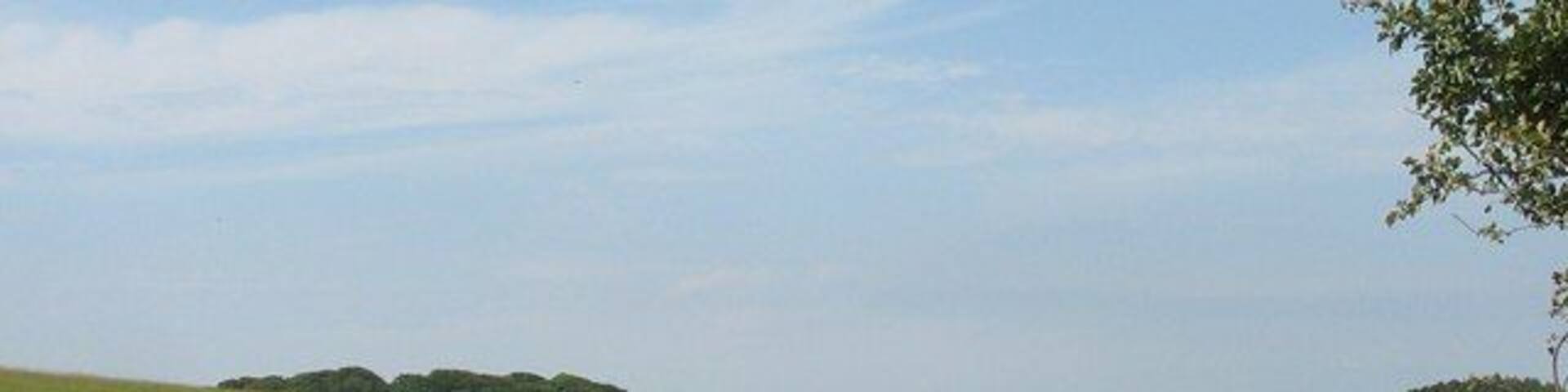 Undulating terrain north of Garreglwyd mansion The ruin on the furthest hill is that of the Old Semaphore/Telegraph Station.