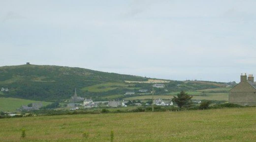 Plas y Gwynt Farmhouse with Llanrhuddlad Church and Mynydd y Garn in the background 1392870
