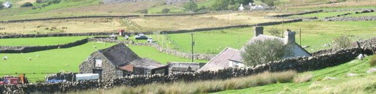 Castell Caeronwy. A small holding on the moorland edge. The name Castell Caeronwy comes from a nearby Iron Age fortlet.