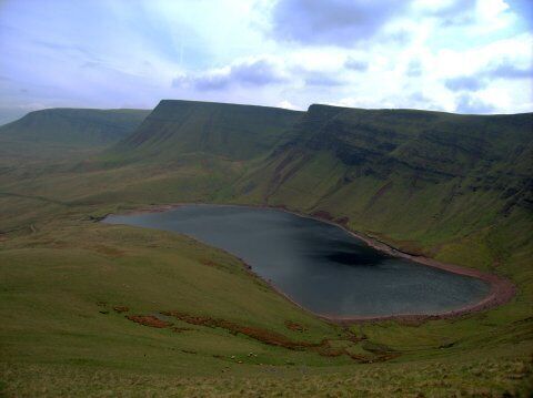 Llyn y Fan Fach and the Bannau Sir Gaer. The lake in its hollow as seen from near the clifftop (in SN7921).