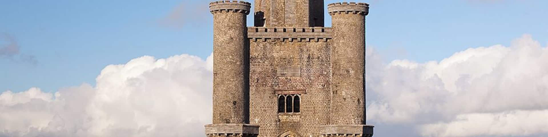 Paxton's Tower (National Trust) is a Neo-Gothic folly / an eyecatcher and banqueting hall / also known as The Nelson Monument / erected by William Paxton in 1806-1809 in honour of Admiral Lord Nelson - killed at the Battle of Trafalgar in 1805. It is a triangular building with a hexagonal castellated roof. On the ground there are three arches to accommodate carriages , with an upper apartment with stained glass windows showing Lord Nelson and scenes from his life. Its hilltop location provides Spectacular views over the Towy (Tywi) valley. William Paxton (1745-1824) spent the fortune he had made in India building a huge neo-classical house Middleton Hall and laying out a park / the hall was destroyed by fire in 1931 / The " National Botanic Garden of Wales" is built on Paxtons Middleton Estate / Leading to the Tower is Paxton's Tower Lodge ( Landmark Trust ) / an early 19C cottage, built for the Tower’s caretaker / SN 541.190 / 7975