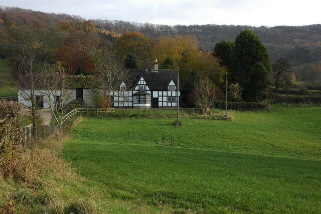 Upper Farm, Great Witcombe Upper Farm, Great Witcombe, is situated below the wooded Birdlip Hill which can be seen in the background.