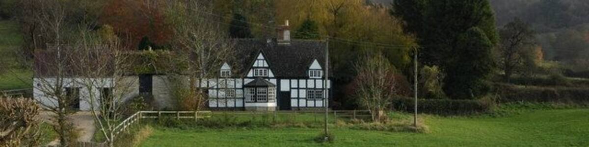 Upper Farm, Great Witcombe Upper Farm, Great Witcombe, is situated below the wooded Birdlip Hill which can be seen in the background.