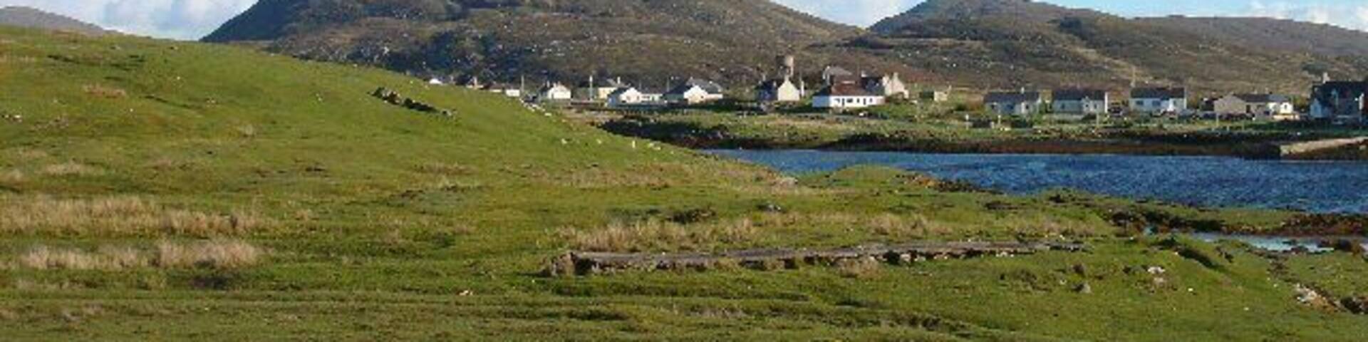 Leverburgh. The town of Leverburgh, viewed from the road leading to the ferry. The hill in the distance is Maodal.