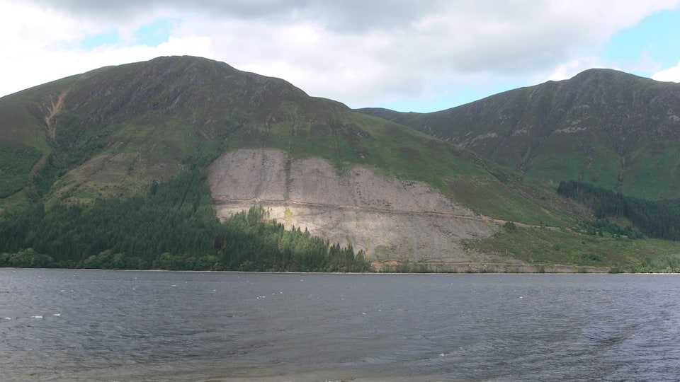 A lake with mountains in the background.