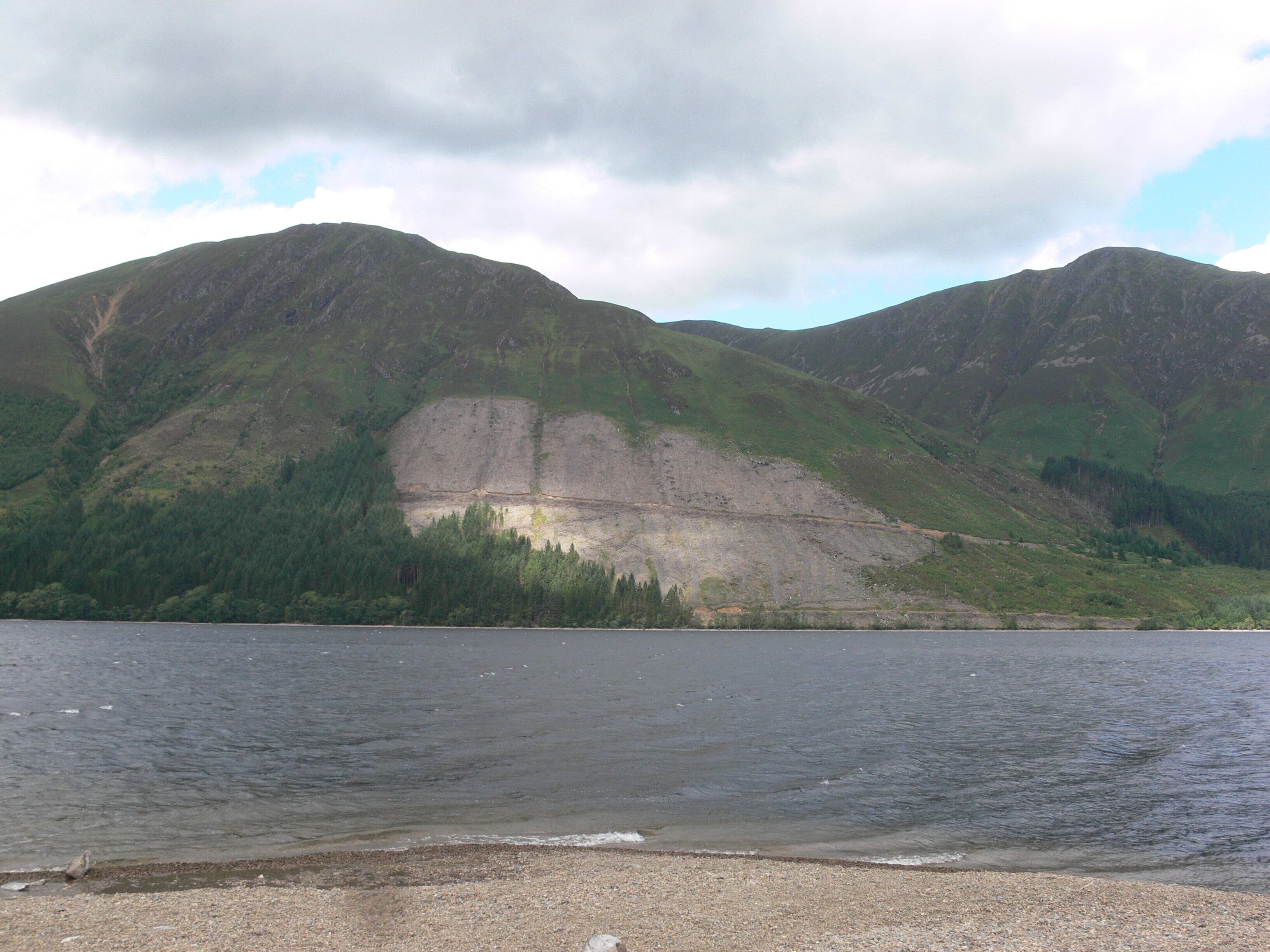A lake with mountains in the background.