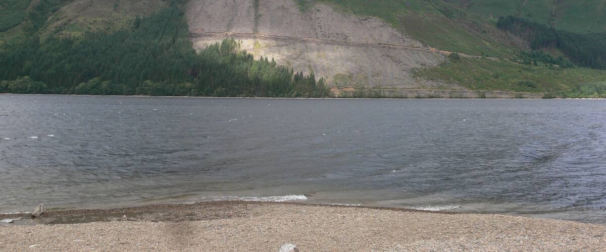 A lake with mountains in the background.