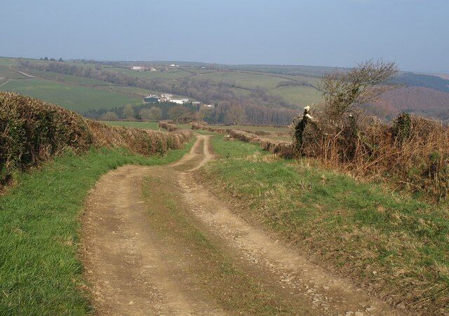 Green lane to Gortlage. An exhilarating route on a bright day. This is the track shown climbing ahead in 701170, here beginning its descent to meet the Langtree Lake valley at Gortlage. The lower set of farm buildings is at Clements Hill in SS4617, with Priestacott above it.