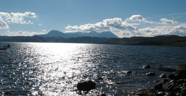 Shoreline at Laide. Looking south east along the shores Of Gruinard bay at Laide. An Teallach dominates the distant skyline.