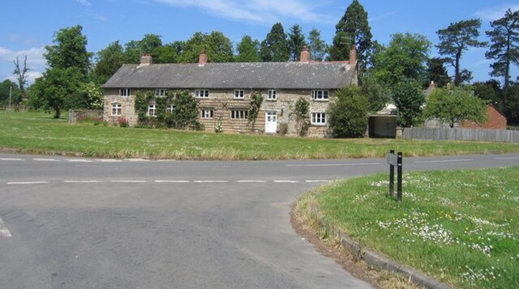 Little Kineton. A row of cottages by the village green with some interesting patterned stonework.