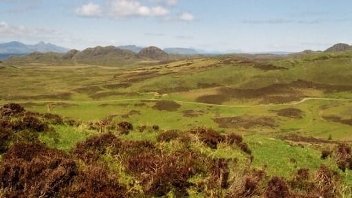Ardnamurchan volcanic centre. This view looks across the heart of Ardnamurchan to the remnants of the ramparts of the volcano which created the peninsula. The Small Isles of Eigg and Rum, also volcanic in origin, can be seen beyond.