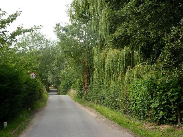 Mill Lane The lane crosses the small river Deben at Kettleburgh. The bridge parapets can be seen beyond the weight restriction sign.