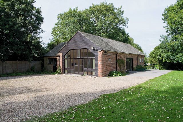 Itchenor Memorial Hall The village hall, funded partly by the Millennium Commission and operated by West Itchenor Parish Council. There is car parking space here. At the entrance there is a notice which reads PRIVATE PROPERTY NO UNAUTHORISED PARKING; I find this objectionable. A hall constructed and maintained by the tax payers ought to be generally available for reasonable use by the public as, indeed, most village hall car parks are. The nearest public car park is over 0.7 Km away via a narrow road with no footway. The Salterns Way passes through West Itchenor just beyond this hall.