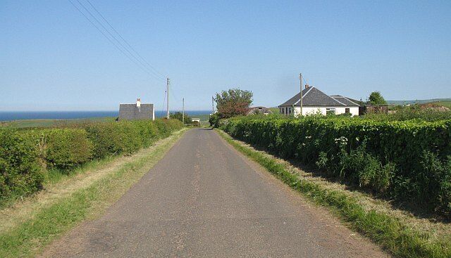 Thorntonloch Holdings Road running through Thorntonloch Holdings, a scattering of dwellings south of the A1.