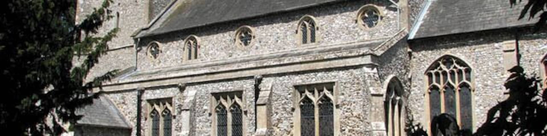 St Michael's church. St Michael's church is hemmed in by houses from all sides > 1300902 and difficult to reach. Although its tower can occasionally be glimpsed over roofs and through trees, there is only a narrow driveway > 1300904 and a short section of path leading to it. The churchyard contains a number of interesting old headstones and the remains of an ancient stone cross > 1300916 are situated right in front of the south porch > 1300909 which dates from the 15th century. The main body of the church > 1300908 was built a century earlier and the chancel wall contains lumps of carstone. The church interior > 1300927 - 1300941 was extensively restored by the architect G.E. Pritchett in the mid-19th century. It was during this time that the stained glass was put in many of the windows. According to the Norfolk churches website, St Michael's contains probably the best collection of late 19th and early 20th century glass of any small church in East Anglia > 1300958 - 1300968 - 1300974. Most of the stained glass windows were made in the workshop of the O'Connors and there is work by Robert Bayne and Christopher Webb. The originally square font has been cut at some state to form an octagon, ruining some of the carving > 1301005 - 1301020. The rood screen > 1300931 is also largely original albeit restored and covered with dark varnish. There is a three figure brass > 1301039 on the west tower wall which dates from 1623 and features Agnes Brigge and her parents. This church is kept locked but a key is available on request. http://www.norfolkchurches.co.uk/ingoldisthorpe/ingoldisthorpe.htm