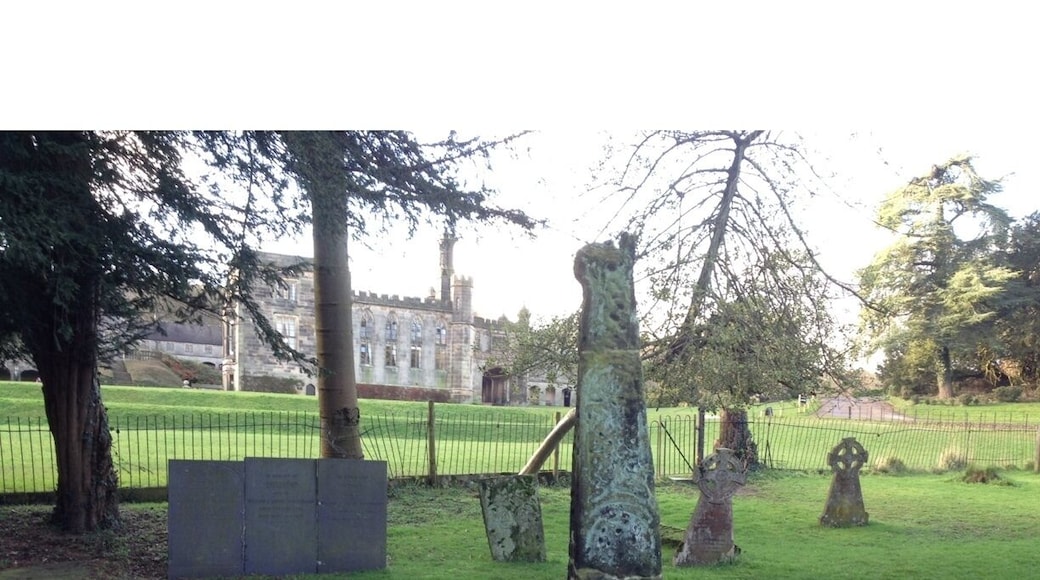 Remains of one of the Saxon crosses in the graveyard of the Church of the Holy Cross, in Ilam, Derbyshire. The church dates from Saxon era although it was considerably rebuilt in Norman and early English times. St. Bertram is buried here.