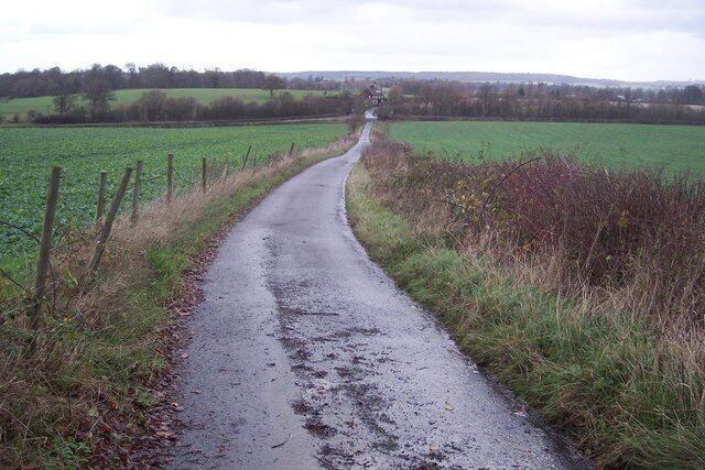 Access road to Etchden Road This track leads from Goldwell (house and Oast House) to the road. It is also a footpath to the road. The Railway Cottages are in the background.