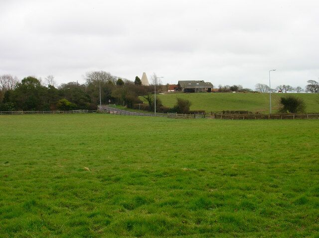 Barnhorn Oast Farm Viewed from the footpath just to the south of the UAE Technical Training Campus and looking across the A259 Barnhorn Road. Beyond the farm the land drops down into the Pevensey Marshes.