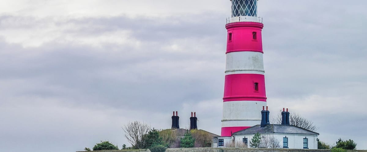 Happisburgh Lighthouse in Happisburgh on the North Norfolk coast is the only independently operated lighthouse in Great Britain. It is also the oldest working lighthouse in East Anglia. The building was constructed in 1790 as one of a pair of candle-powered lights. It was electrified in 1947. The tower is 85 ft tall, putting the lantern at 134 ft above sea level.