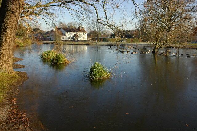 The Swan and pond, Hanley Swan The Swan Inn at Hanley Swan viewed across the frozen village pond.