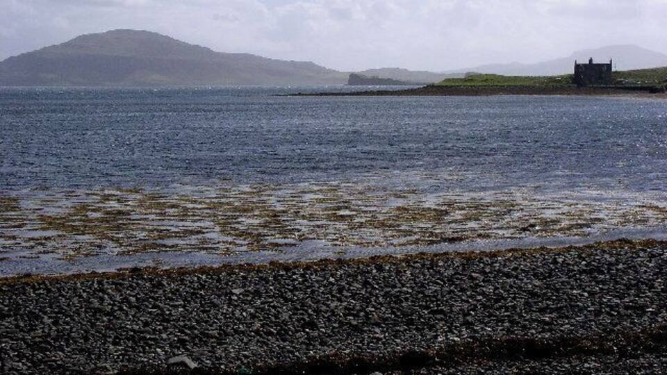 Ardmore Bay. On the shingle beach of Ardmore Bay in Waternish, with Ardmore House on the right