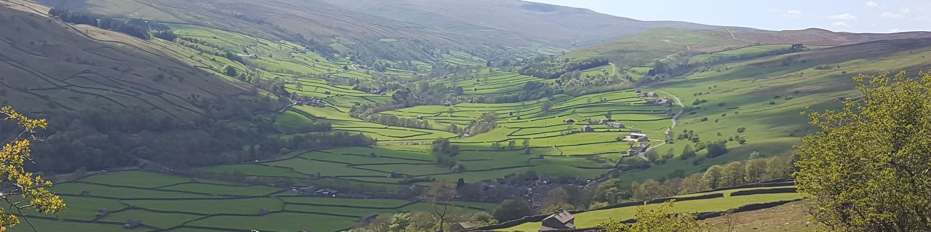 Looking West up Swaledale towards the village of Gunnerside in the Yorkshire Dales. Swaledale is the wildest and loveliest of the Dales.