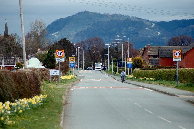 Guilsfield from Groes-Lwyd View of entrance to Guilsfield from Groes-Lwyd. In the background can be seen the Breidden Hills and Rodney's Pillar on the skyline above the road.