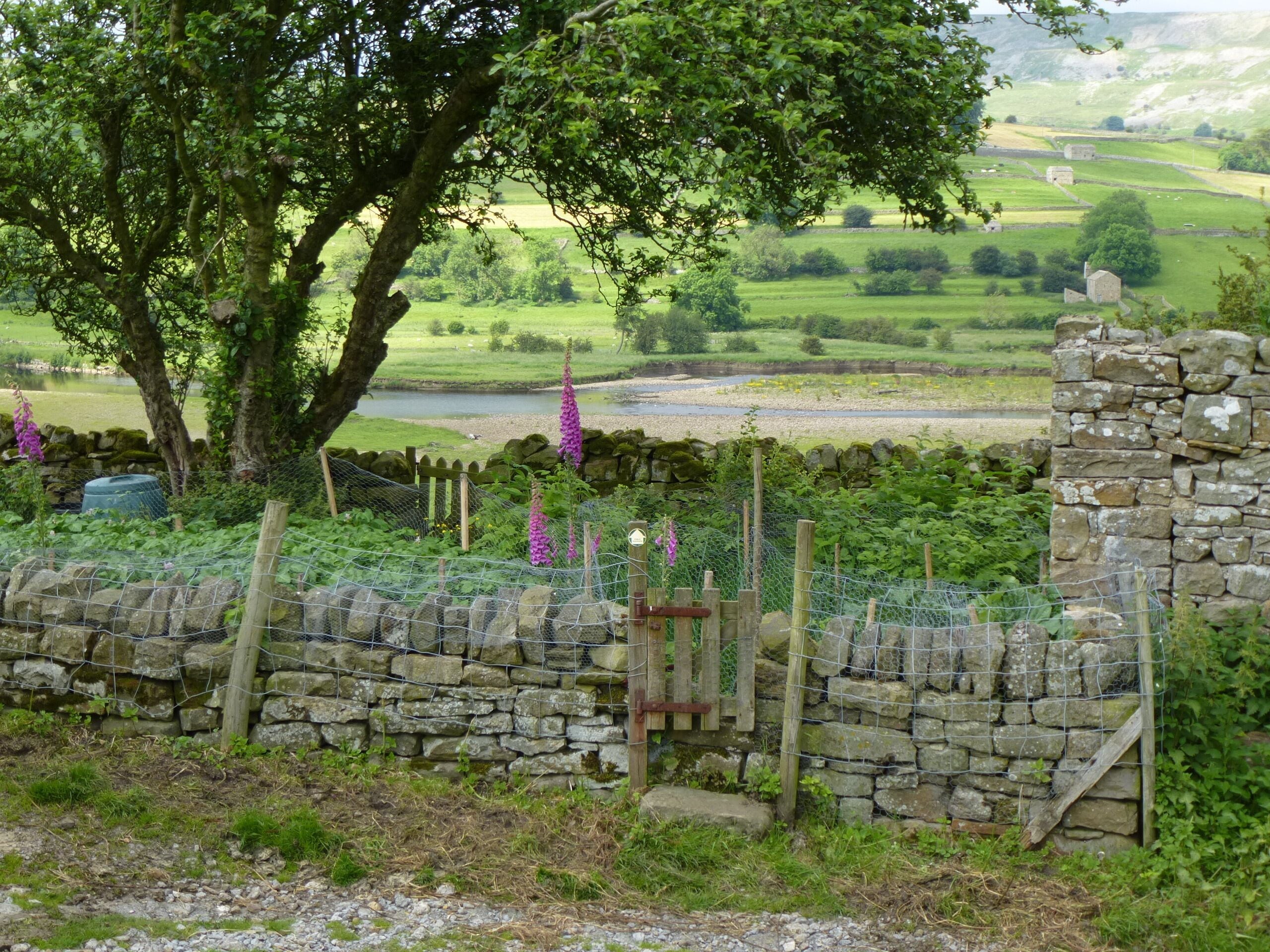 Public footpath leading through a small private garden, Reeth, North Yorkshire
