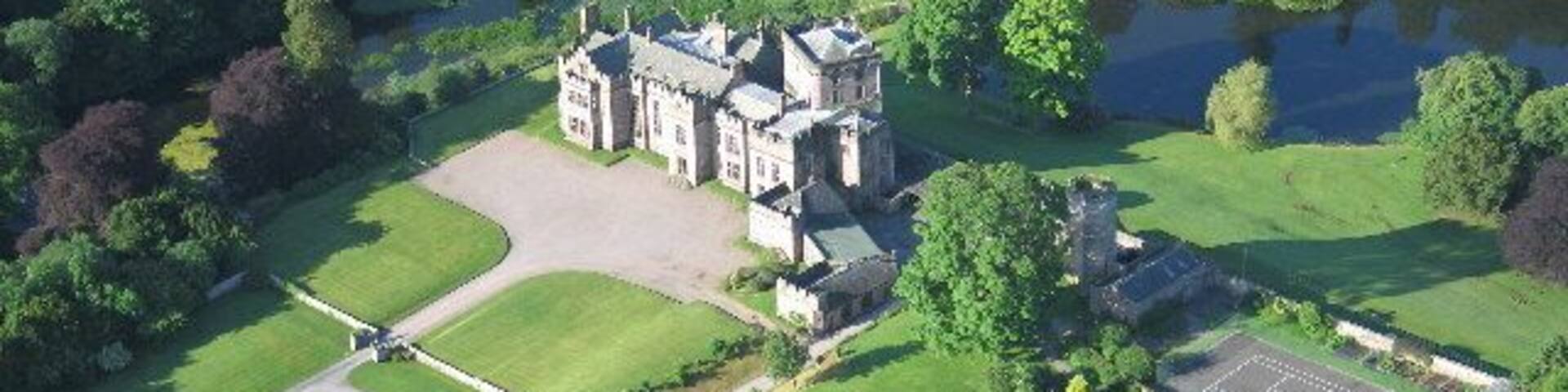 Greystoke Castle is in the village of Greystoke 8 km west of Penrith in the county of Cumbria in northern England.
