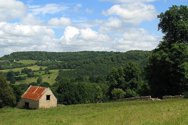 Stone barn near Witcombe Wood Taken from a bridleway leading from the Cotswold Way down to Great Witcombe. In the distance is Birdlip Hill and The Peak.