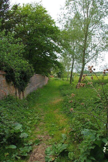 Braxted Park Boundary This is the boundary wall of Braxted Park House Estate the photo is looking along the footpath on the north eastern boundary of the park