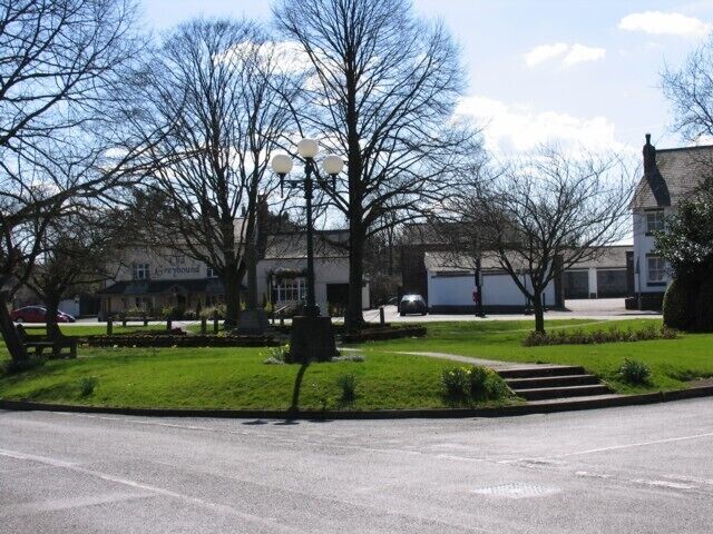 Village Green Great Glen. The village Green in Great Glen with the Old Greyhound public house in the background. The A6 trunk road used to thunder through the village but a recent bypass has left it much quieter.