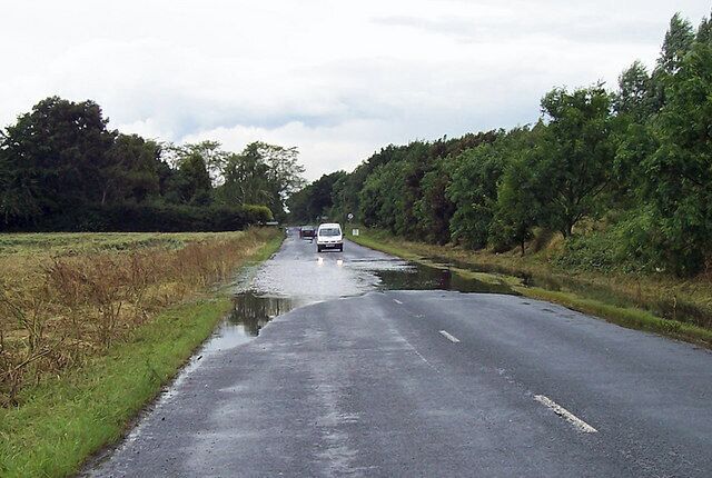 Road Flooded near College Farm, north east of Thornton Curtis, Lincolnshire, England. Flooding on the road to Goxhill after recent heavy rain.