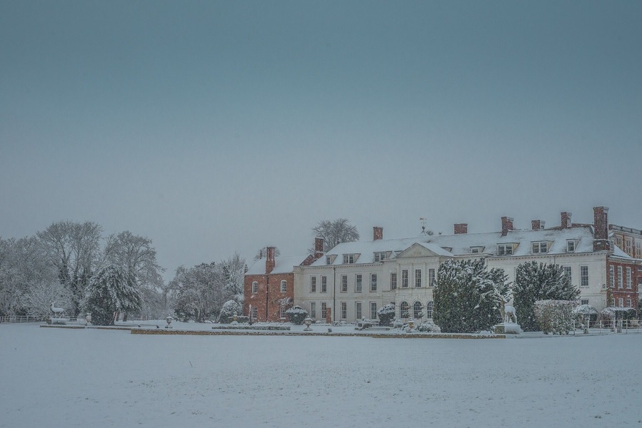 Gosfield Hall is a magnificent building with noble connections, home to many kings and queens in the past. Overlooking a tranquil lake, the historical mansion is set among 10 acres of parkland in the heart of picturesque rural Essex. A seamless combination of Elizabethan charm and Georgian elegance, the grand interior of the house is home to the Queen’s Gallery, Grand Salon, Marquis of Buckingham’s former Ballroom and Library along with a number of stately bedrooms.
Externally, Gosfield Hall is equally as impressive. The property has retained many of his historical period features including its leaded windows, chimneys and clock and weathervane.
After being exiled from France King Louis XVIII of France and Navarre, and his Queen Mary-Josephe-Louise of Savoy took refuge in England. Lord Buckingham had long been in sympathy of Royalsit France, and in 1807 offered to loan them Gosfield Hall. They gratefully accepted this offer and along with a huge entourage of courtiers and staff they stayed there for the next couple of years. Over this time the Hall become a home of lavish French hospitality, with many social gatherings including such distinguished guests as the Prince Regent. According to French tradition on Sunday's the villagers were allowed into the kitchen to see the dinner set out for the King, and on occasions were allowed into The Grand Salon to watch him dine. King Louis and his Queen moved out of the Hall in 1809.
#history #instone #landscape #december #winter #uk #britain #england #anglomania #gosfieldhall #snow #winterwonderland #weddingvenue