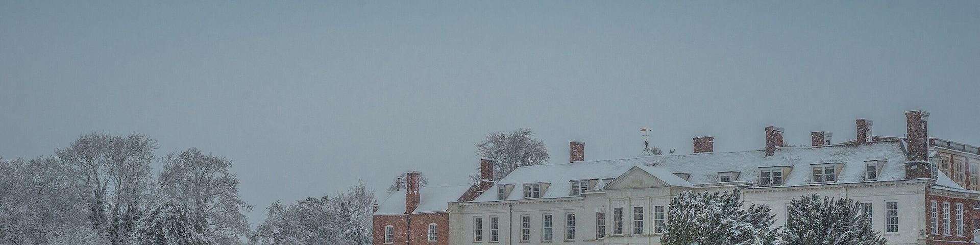 Gosfield Hall is a magnificent building with noble connections, home to many kings and queens in the past. Overlooking a tranquil lake, the historical mansion is set among 10 acres of parkland in the heart of picturesque rural Essex. A seamless combination of Elizabethan charm and Georgian elegance, the grand interior of the house is home to the Queen’s Gallery, Grand Salon, Marquis of Buckingham’s former Ballroom and Library along with a number of stately bedrooms.
Externally, Gosfield Hall is equally as impressive. The property has retained many of his historical period features including its leaded windows, chimneys and clock and weathervane.
After being exiled from France King Louis XVIII of France and Navarre, and his Queen Mary-Josephe-Louise of Savoy took refuge in England. Lord Buckingham had long been in sympathy of Royalsit France, and in 1807 offered to loan them Gosfield Hall. They gratefully accepted this offer and along with a huge entourage of courtiers and staff they stayed there for the next couple of years. Over this time the Hall become a home of lavish French hospitality, with many social gatherings including such distinguished guests as the Prince Regent. According to French tradition on Sunday's the villagers were allowed into the kitchen to see the dinner set out for the King, and on occasions were allowed into The Grand Salon to watch him dine. King Louis and his Queen moved out of the Hall in 1809.
#history #instone #landscape #december #winter #uk #britain #england #anglomania #gosfieldhall #snow #winterwonderland #weddingvenue