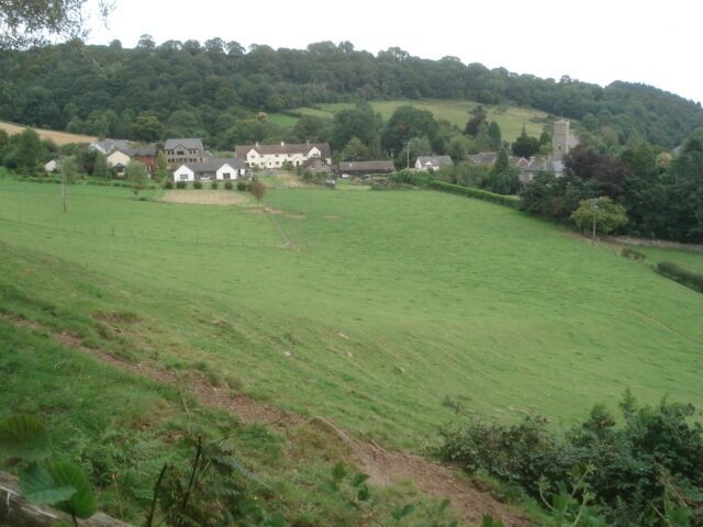 Sheep field near Llowes Looking eastwards on emerging from the woods with Llowes village beyond.