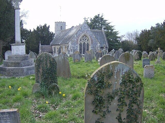 St. Michael's church, Geldeston The churchyard to the east. One of 124 round tower churches in Norfolk. The church dates from about 1150.
