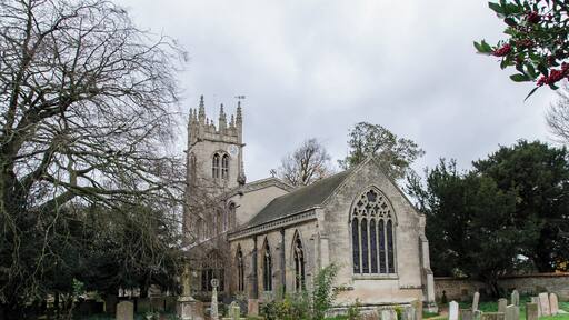 The church of St Nicholas is mainly of three periods, which may be dated around the years 1220, 1320 and 1470. There are some remnants in the church of an earlier building, for instance, the remains of the round Norman window, which can be seen in the south wall of the nave, the piece of carved stone built into the wall in the sanctuary. These two latter pieces of Norman work were dug up inside the church when the chancel arch was being restored in 1888. The only other piece of Norman work in the church is the font which is late Norman (around 1180). About the year 1220 the church was rebuilt, its length being the same as now, its width was somewhat less, the aisles being low and narrow. The roof was steep-pitched. Of this early 13th C. church there remains the pillars, the arcades, the lower part of the tower and the lower part of the chancel. The "trefoil" doorway into the chancel and the sedilia are Early English in date. About the year 1320 the side aisles were pulled down and the present aisles, porch and north and south doorways were built. The rounded C13 moulding giving way to a C14 pattern. The south aisle was apparently used as a side chapel with an altar at the east end. There still remains the brackets on which statues stood and the piscina, the floor of which has been delicately chiselled into the form of a cross. About the year 1470 the last great alteration to the church took place. The steep pitched roof gave way to a high flat roof and the church, which until now must have been dark, was lightened by the addition of clerestory windows. At the same time the tower was heightened and much of it rebuilt. The pinnacle at the south east corner of the clerestory carries the arms of the Myddletons of Fulbeck. The crest, a Saracens head surmounting a shield with a lion rampant, a belt with escallop shells supported on either side by a Harpy and a Wyvern. The Myddletons were the owners of Fulbeck from about the year 1430 to 1480. The church contains monuments to the Fanes of Fulbeck Hall.